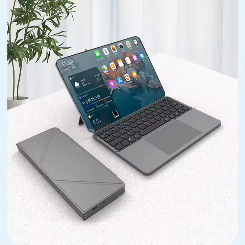 Foldable device with screen and keyboard on a white surface