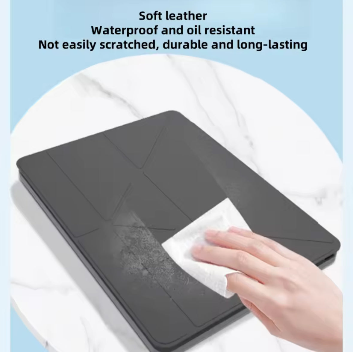 Black leather case being wiped with a cloth on a white surface, with text about its properties.